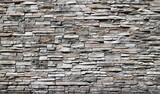 Fototapeta Desenie - Stone cladding wall made of striped stacked bricks of natural brown and gray rocks . 