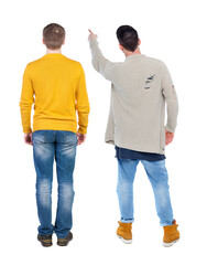 Poster - Back view of two man in sweater pointing.