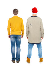 Wall Mural - Back view of two man in sweater pointing.