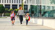 © JenkoAtaman - first day at school. mother leads  little children girl and boy in grade