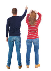 Wall Mural - Back view of couple in sweater pointing.