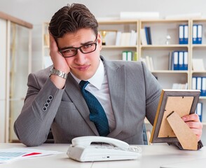 Businessman looking at the picture frame