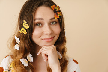 Canvas Print - Photo of woman with fake butterflies posing and looking at camera