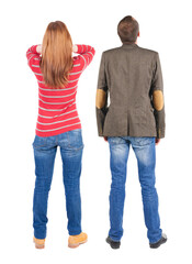 Wall Mural - Back view couple in sweater. beautiful man and woman.