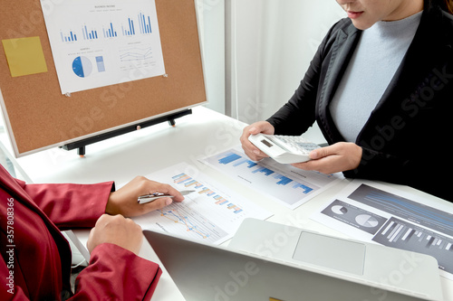 Cuadros en Lienzo Two business leader discussing the charts and graphs showing the results, Planni