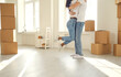 © Studio Romantic - Happy family couple hugs dancing in a new apartment.