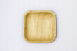Square Areca Leaf Plate, eco-friendly disposable cutlery. Top view on a white background.