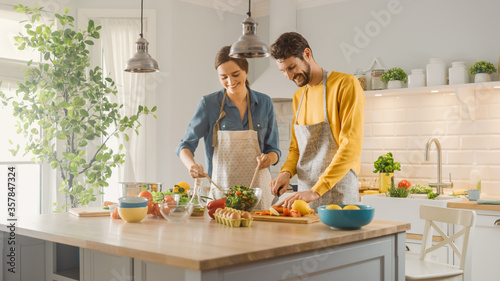 Cuadros en Lienzo In Kitchen: Perfectly Happy Couple Preparing Healthy Food, Lots of Vegetables