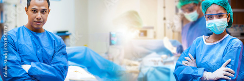 Fotomural Team of doctors or surgeons in hospital surgery operating emergency room showing patient heart rate, medical concept during corona virus or Covid-19 concept