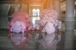 © rachaphak - Hands of two muslim woman on the reflection floor praying in traditional clothes.