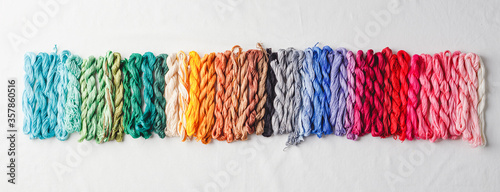 Fotomural Colorful pattern background from embroidery thread