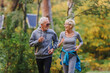 © lordn - Smiling senior couple jogging in the park