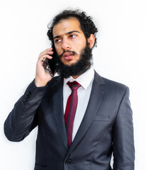 Wall Mural - Muslim man wearing tuxedo and talking on the phone