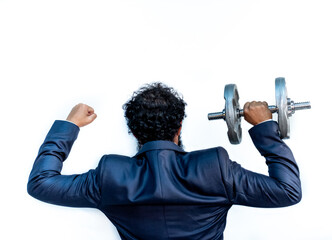 Wall Mural - Strong muslim man holding weights while wearing tuxedo