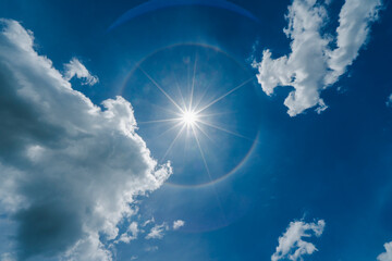 fantastic beautiful sun halo phenomenon with sun ray and flare.