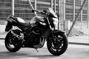 Wall Mural - Black motorcycle close-up on the street.