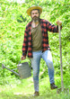 © be free - man with watering can and shovel. gardening and watering plants. agriculture and tough work concept. Gardening or planting concept. Man using a big shovel for digging old lawn