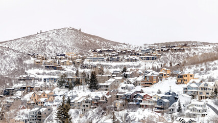 Canvas Print - Panorama Park City Utah mountainscape with homes on a snowy neighborhood in winter