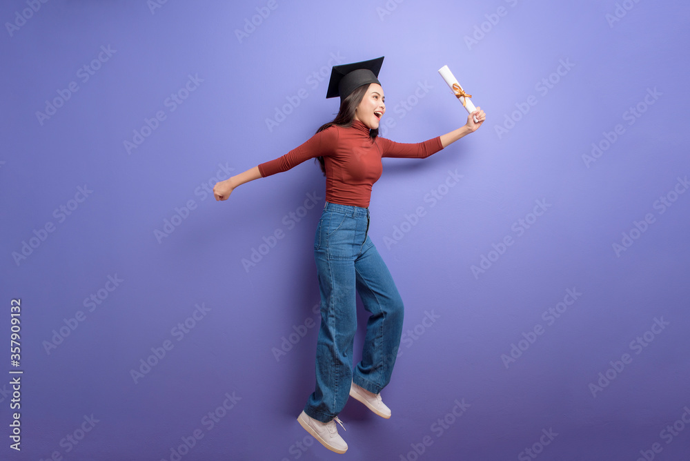 Portrait of young University student woman with graduation cap on ...
