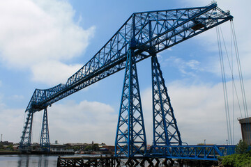 Canvas Print - The Tees Transporter Bridge at Middlesbrough. Showing the gondola bridge and the surrounding dock area.