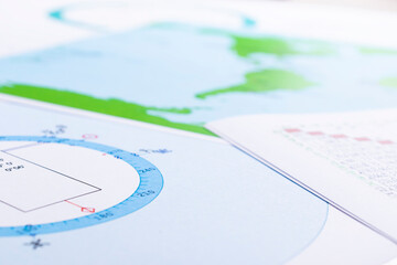 Wall Mural - The desktop of an astrologer. The magical mysterious atmosphere of the working environment of the predictor of the future. Printouts of astrological charts and tables scattered across the table.