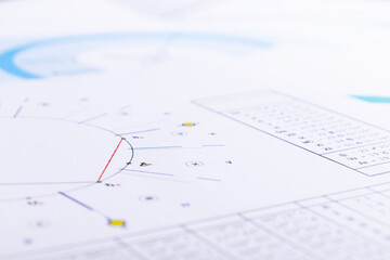 Wall Mural - The desktop of an astrologer. The magical mysterious atmosphere of the working environment of the predictor of the future. Printouts of astrological charts and tables scattered across the table.