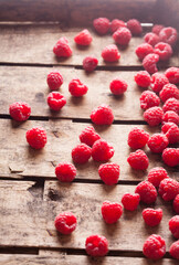 Wall Mural - Raspberries fresh colorful overhead arrangement in old rustic wooden box on bright light selective focus studio shot