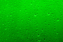 Water Drops On Glass With Vivid Medium Contrast Emerald Green Color