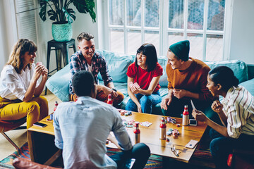 Friends spending free time together in flat