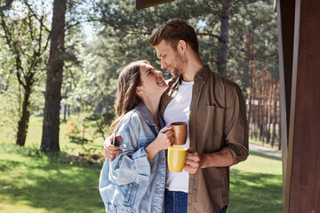 Wall Mural - Stylish couple expressing romantic feelings during open air rest