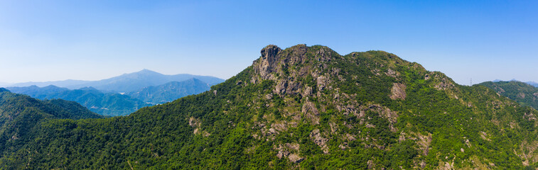 Wall Mural - Hong Kong lion rock mountain from blue sky