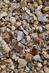 Canvas Print - Vertical high angle shot of many small stones of different colors