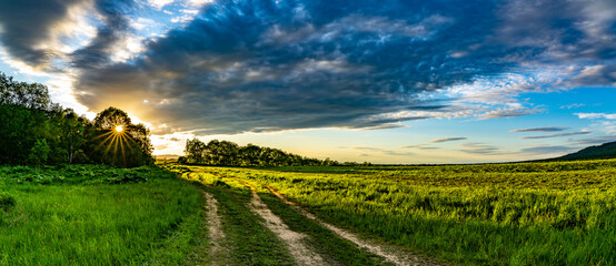 Country road at dawn far from civilization