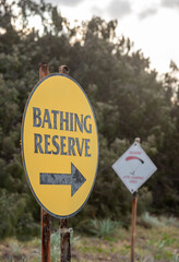 corroded bathing reserve sign on Tannum Sands beach, Gladstone Region, Queensland