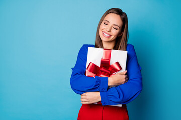 Sticker - Photo of attractive business lady hold arms big giftbox eyes closed present from boss colleagues wear red luxury trousers suit blouse shirt isolated blue color background