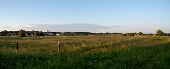 Wall Mural - Panoramic view during sunset over the farmlands in the outskirts of the university town of Lund, Sweden