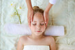© Viktoriia M - Masseur doing face massage to child.