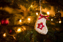 Traditional Advent Calendar Stocking With The Date Of The Second Of December Hanging On A Traditional Christmas Tree.