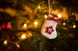 Traditional Advent Calendar Stocking with the date of the eleventh of December hanging on a traditional christmas tree.