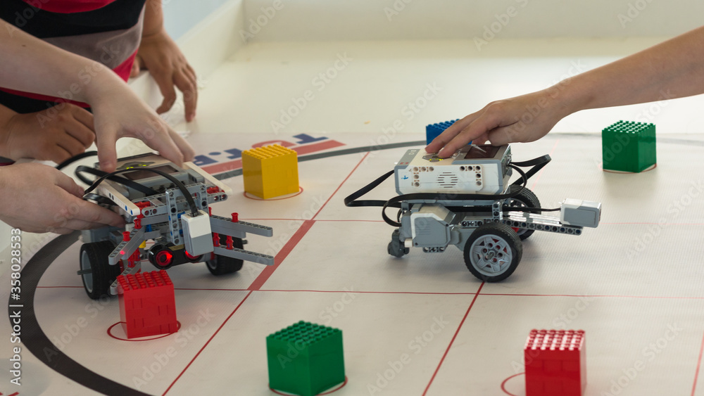 Minsk, Belarus. March, 2018. Boys construct and code robots. Lego ...