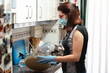 Woman disinfecting food in the kitchen