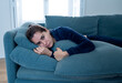 © SB Arts Media - Young sad woman suffering from depression feeling lonely and hopeless isolated at home