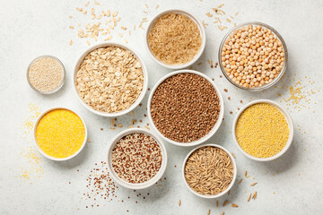 Wall Mural - Set with various cereal grains on stone background