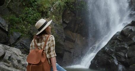 Sticker - Woman enjoy the waterfall in forest