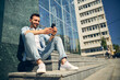 © Svitlana - Positive delighted young man reading income message