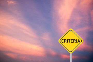 Poster - Yellow color transportation sign with word criteria on violet cloud sky background