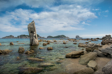 Poster - Large stones in the sea with a transparent bottom