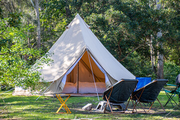 glamping camping teepee tent and chairs at the campsite