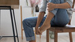 © fizkes - Close up of exhausted businesswoman touch massage foot suffer from uncomfortable heels shoes at work, tired unwell female feel discomfort in legs, relieve pain from feet ache, have strained muscle