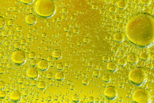 Golden Yellow Bubble Oil Or Serum, Abstract Yellow Water Bubbles Background